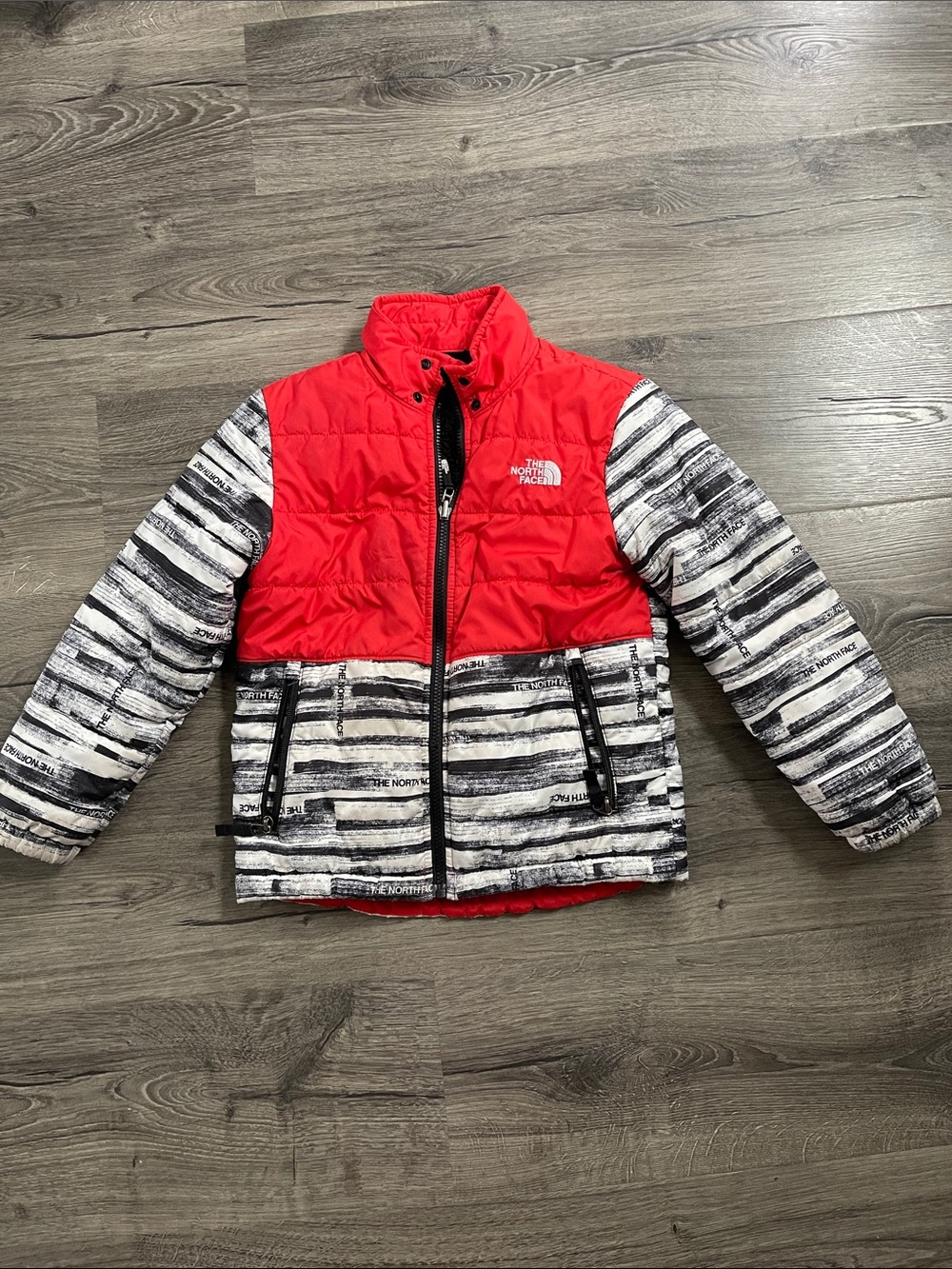 The North Face Kids Red Top with Black & White Striped Puffer Jacket